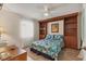 Bedroom features a built-in wooden bookcase and room for a bed and desk at 507 Pine Hollow Cir # 507, Englewood, FL 34223