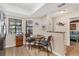 Cozy breakfast nook features a glass table, wicker chairs and views to the outside at 507 Pine Hollow Cir # 507, Englewood, FL 34223