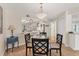 Light and airy dining area with views into the kitchen at 507 Pine Hollow Cir # 507, Englewood, FL 34223