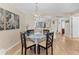 Dining area with decorative lighting is adjacent to open concept kitchen and cozy living room at 507 Pine Hollow Cir # 507, Englewood, FL 34223