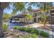 Exterior view of condo with private covered parking, and sidewalk at 507 Pine Hollow Cir # 507, Englewood, FL 34223
