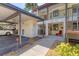 Well-maintained condo exterior featuring carport, walkway, and landscaping at 507 Pine Hollow Cir # 507, Englewood, FL 34223