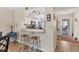 Kitchen view with breakfast bar, counter seating, and modern lighting at 507 Pine Hollow Cir # 507, Englewood, FL 34223