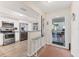 Modern kitchen with stainless steel appliances and convenient access to outdoor patio at 507 Pine Hollow Cir # 507, Englewood, FL 34223