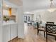 Open-concept floor plan featuring a laundry closet, dining space, and living room at 507 Pine Hollow Cir # 507, Englewood, FL 34223