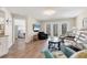 Inviting living room with wood floors, comfortable seating, and access to outdoor space at 507 Pine Hollow Cir # 507, Englewood, FL 34223