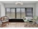 Cozy sunroom features tile floors and large windows with ample light at 507 Pine Hollow Cir # 507, Englewood, FL 34223