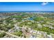 An aerial view shows the location of a pool home within a well-wooded, residential community at 6206 Marcum St, Englewood, FL 34224