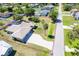 Charming single-story home with a screened pool, mature trees, and a long driveway at 6206 Marcum St, Englewood, FL 34224