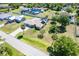 Aerial view of a well-maintained home featuring a screened pool and lush landscaping at 6206 Marcum St, Englewood, FL 34224