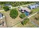 Aerial view of the home featuring the screened pool, mature trees, and spacious backyard at 6206 Marcum St, Englewood, FL 34224