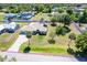 An aerial shot showcases this home with a pool, surrounded by trees and a spacious yard at 6206 Marcum St, Englewood, FL 34224