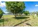 Spacious backyard featuring mature trees, offering shade and enhancing privacy of the property at 6206 Marcum St, Englewood, FL 34224