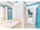 Bright bathroom featuring colorful fish themed wallpaper, a sink, and an outside view at 6206 Marcum St, Englewood, FL 34224