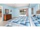 Comfortable bedroom with light blue walls and a backyard view for serene relaxation at 6206 Marcum St, Englewood, FL 34224