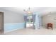 Inviting dining area with stylish lighting, and sliding glass doors to the lanai at 6206 Marcum St, Englewood, FL 34224