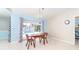 Dining room with a table and chairs next to a window view of the pool at 6206 Marcum St, Englewood, FL 34224
