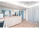 Open kitchen with tile floor flows into dining and laundry areas, great for entertaining at 6206 Marcum St, Englewood, FL 34224