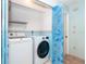 Convenient laundry room with modern washer and dryer units, plus storage at 6206 Marcum St, Englewood, FL 34224