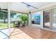 Relaxing patio area with seating, offering views into the home and backyard at 6206 Marcum St, Englewood, FL 34224