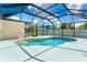 Sparkling screened-in pool with clear blue water and spacious deck, perfect for relaxation at 6206 Marcum St, Englewood, FL 34224