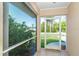 The screened porch has lots of shade and offers a view of the lawn at 6206 Marcum St, Englewood, FL 34224