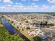 An aerial view displays homes in a waterfront community and canal access at 6417 Klaus Ct, Port Charlotte, FL 33981