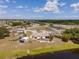 Aerial view of a home with a pool and a large lot, complemented by serene water views at 6417 Klaus Ct, Port Charlotte, FL 33981