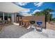 A backyard featuring a privacy fence, shade sail, and a pair of barbeque grills at 6417 Klaus Ct, Port Charlotte, FL 33981