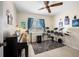 Bedroom with a ceiling fan, wood flooring, a large window, and instruments at 6417 Klaus Ct, Port Charlotte, FL 33981