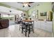 Coffee Bar island has seating for four, opens to living room with luxury vinyl floors at 6417 Klaus Ct, Port Charlotte, FL 33981