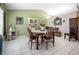 Eat-in Dining Room featuring a wooden table, white tile floors and matching hutch at 6417 Klaus Ct, Port Charlotte, FL 33981