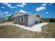 Side view of home with stone accent and white stone landscaping, also showing the AC unit at 6417 Klaus Ct, Port Charlotte, FL 33981