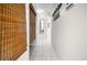 Hallway with a mirror, tile flooring, leading to additional rooms in the house at 6417 Klaus Ct, Port Charlotte, FL 33981