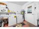 Functional laundry room with washer, dryer, and ample storage space at 6417 Klaus Ct, Port Charlotte, FL 33981