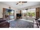Open living room showcasing access to the pool, comfortable seating, and natural light at 6417 Klaus Ct, Port Charlotte, FL 33981