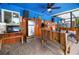 Covered outdoor seating area, featuring wooden benches, wall decor, and decorative accents at 6417 Klaus Ct, Port Charlotte, FL 33981