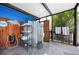 An outdoor shower area featuring metal shelving and blue walls with a dolphin sculpture at 6417 Klaus Ct, Port Charlotte, FL 33981