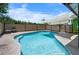 Refreshing pool area with an inviting pool, surrounding deck, and privacy fence at 6417 Klaus Ct, Port Charlotte, FL 33981