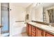 Well-lit bathroom with double sink vanity, soaking tub, and separate shower at 6461 Thorman Rd, Port Charlotte, FL 33981