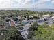 Lush aerial view of a town featuring a lively street fair, numerous shops, and a glimpse of the scenic bay at 7234 Mamouth St, Englewood, FL 34224