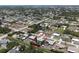 Wide aerial shot showing the neighborhood, with the property highlighted in a red circle at 7234 Mamouth St, Englewood, FL 34224