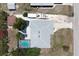Bird's eye view of the home's layout, featuring a pool, patio, garden, and the arrangement of buildings on the property at 7234 Mamouth St, Englewood, FL 34224