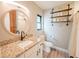 Stylish bathroom features a decorative mirror, shelves, and modern fixtures at 7234 Mamouth St, Englewood, FL 34224