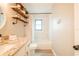 Bright bathroom features a granite countertop and white tiled shower with tub at 7234 Mamouth St, Englewood, FL 34224