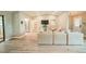 Modern living room featuring wood flooring, stylish furniture, and access to outdoor spaces at 7234 Mamouth St, Englewood, FL 34224