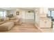 Stylish living room with an open layout flowing into the updated kitchen with granite counters at 7234 Mamouth St, Englewood, FL 34224