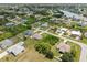 An aerial photo shows a cluster of homes near a body of water at 7393 Mamouth St, Englewood, FL 34224