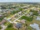 Residential neighborhood with single Gathering homes, mature trees, and scenic streets at 7393 Mamouth St, Englewood, FL 34224