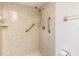 Shower with tan tiling and safety rails at 7393 Mamouth St, Englewood, FL 34224